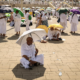 Muslim pilgrims use umbrellas to shade themselves from the sun as they arrive at the base of Mount Arafat during the hajj © Fadel SENNA / AFP